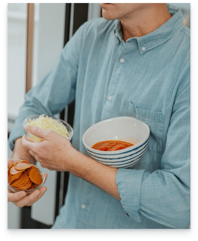 Greg Gall takes his ingredients out of the fridge.